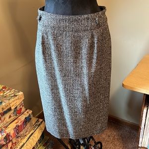 Dress Barn gray (black/white tweed) skirt with pleated panel in back. Size 14.
